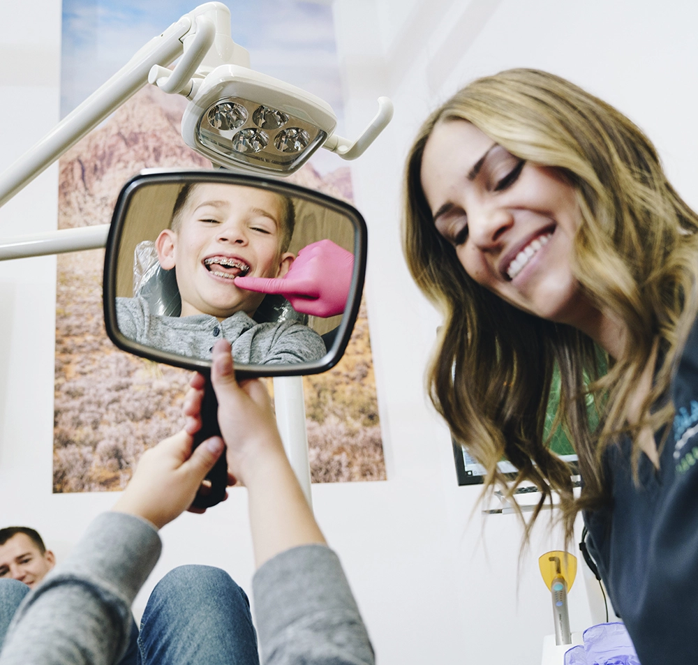 nurse showing patient new braces, Local Las Vegas Orthodontist, Truman Orthodontics.